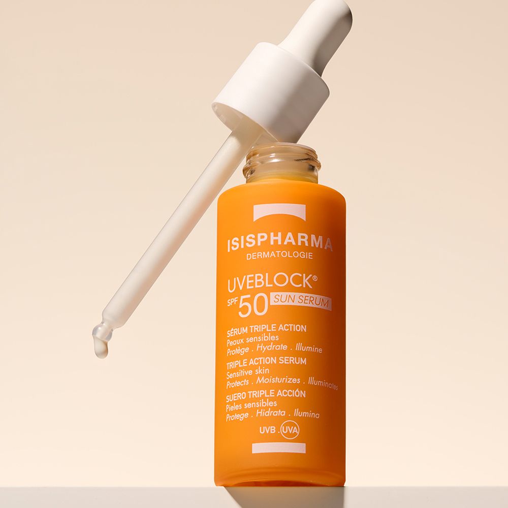 Orangefarbene Flasche mit Pipette. ISISPHARMA Uveblock SPF 50+ Sun Serum.