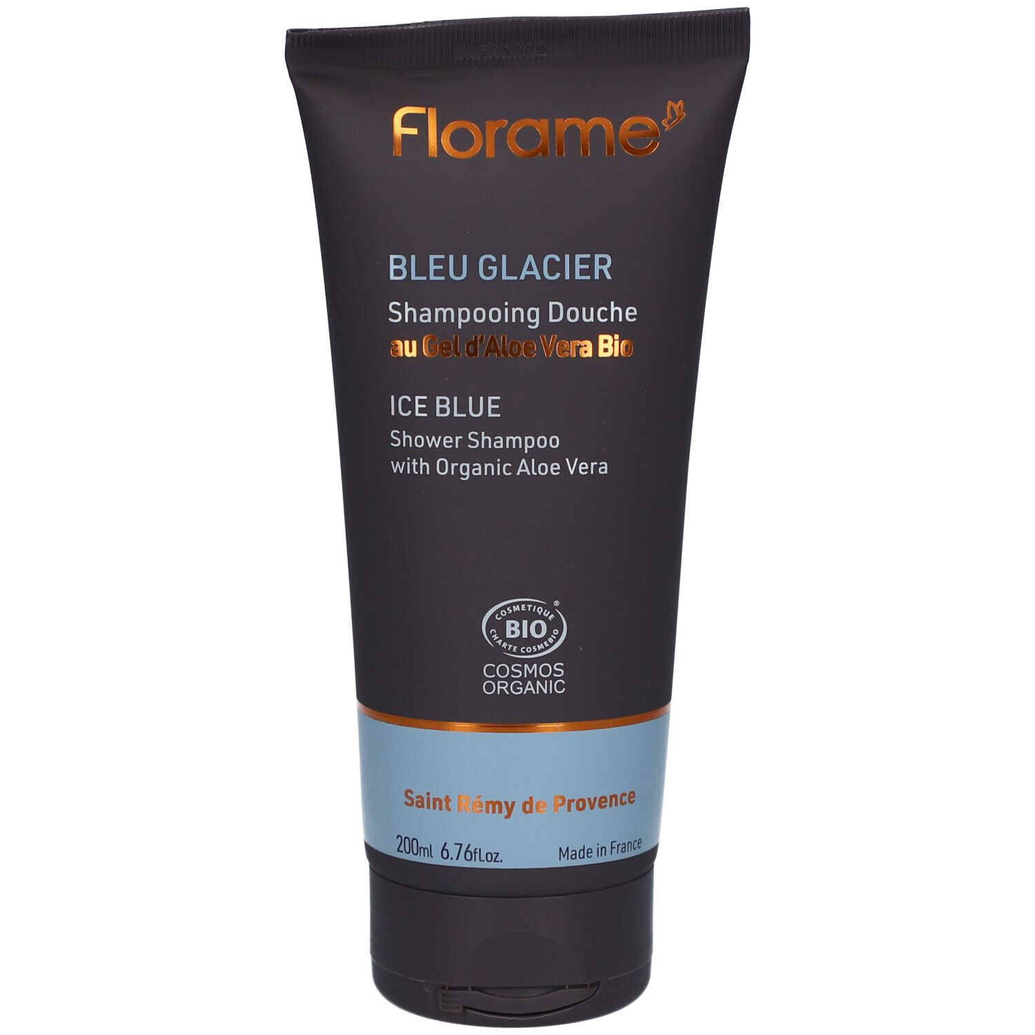 Tube bleu foncé avec logo et nom du produit. Texte: Bleu Glacier, Ice Blue, certification bio. Bouchon noir.
