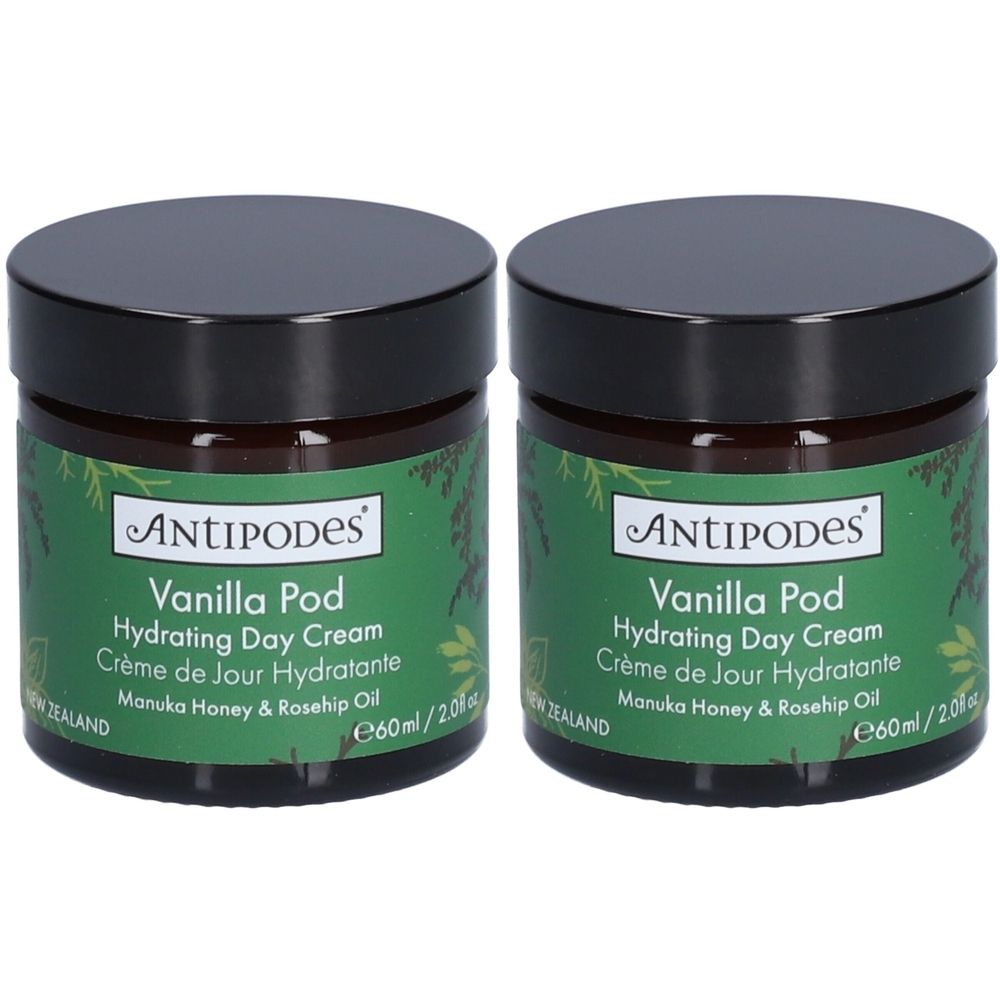 Deux pots de crème de jour hydratante ANTIPODES Vanilla Pod. Couvercles noirs, étiquettes vertes avec informations produit.