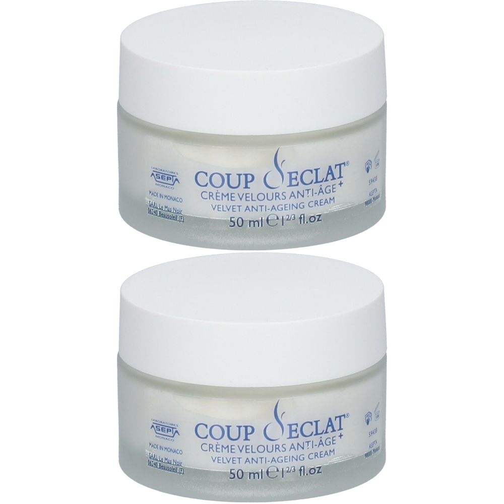 Deux pots de crème Velours Anti-Âge+. Couvercles blancs, pots transparents. Inscription : Coup d'Éclat, 50 ml.
