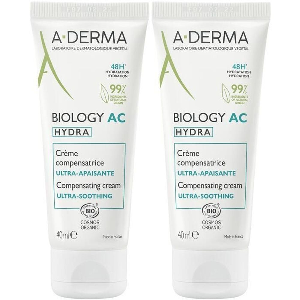 Deux tubes de crème A-DERMA BIOLOGY AC HYDRA. Tubes blancs avec texte vert. Inscription: Ultra-apaisante, 48H Hydratation, 99% ingrédients d'origine naturelle.
