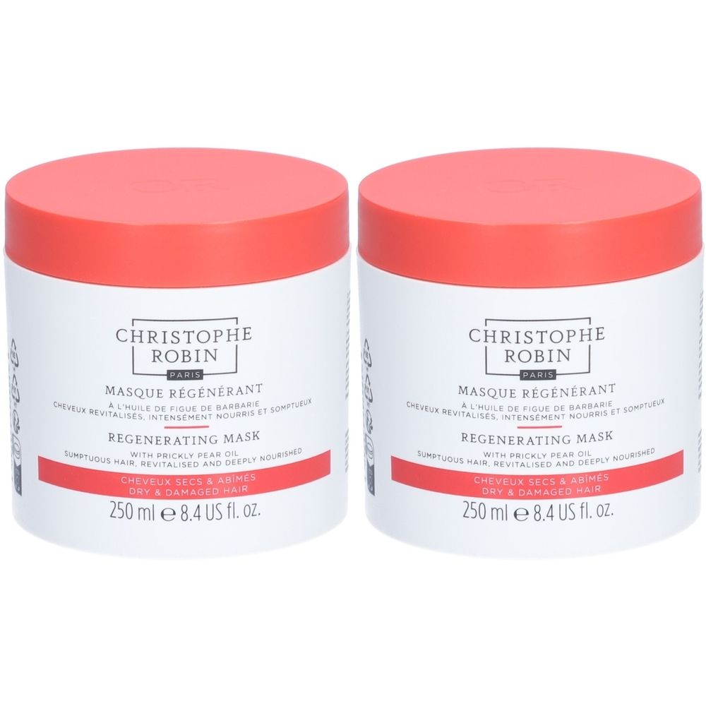 Zwei runde Tiegel mit rotem Deckel. Aufschrift: CHRISTOPHE ROBIN, MASQUE RÉGÉNÉRANT, REGENERATING MASK. Für trockenes, geschädigtes Haar.
