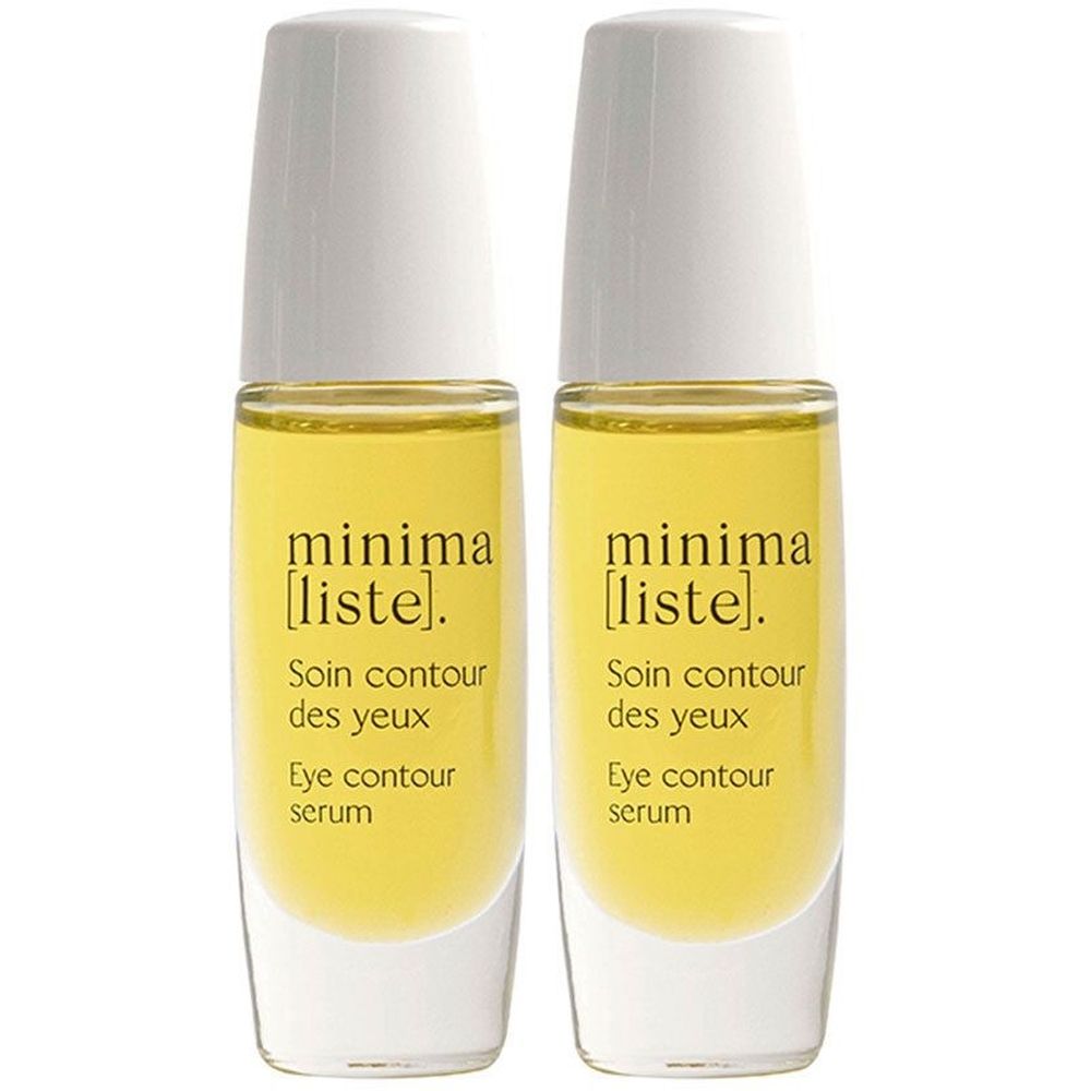 Zwei Flakons mit gelber Flüssigkeit und weißen Deckeln. Aufschrift: minima [liste]. Soin contour des yeux, Eye contour serum.