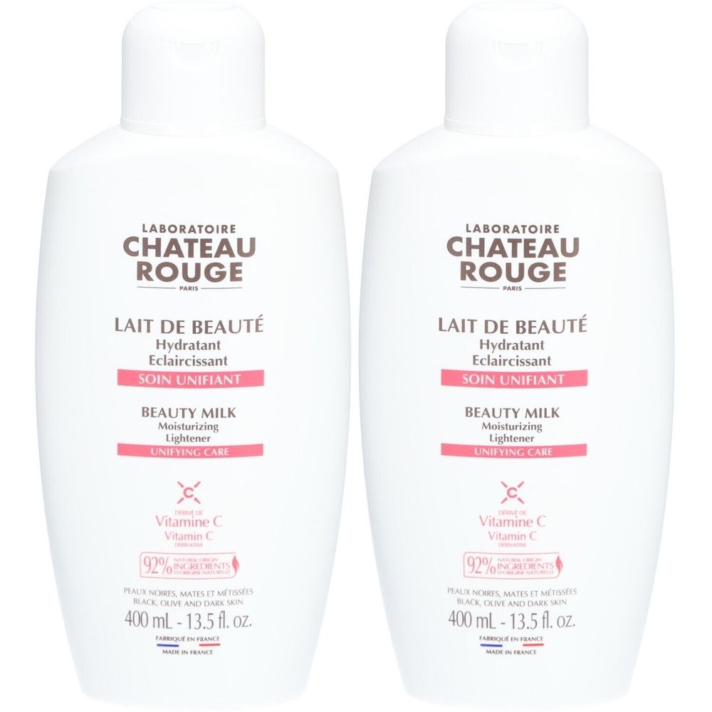 Deux flacons blancs avec étiquettes. Inscription : Laboratoire Château Rouge, Lait de Beauté, Soin Unifiant, Beauty Milk.