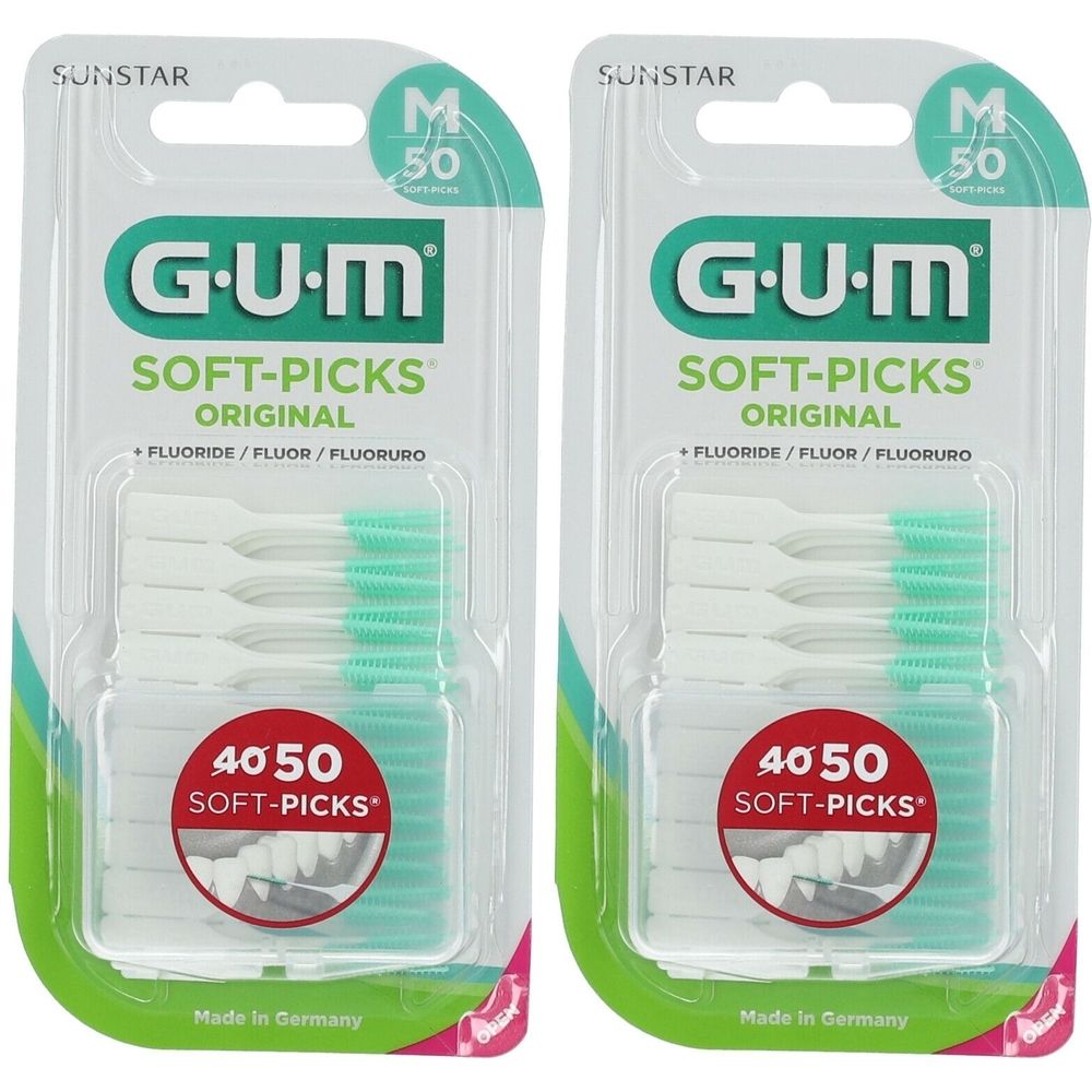 Deux paquets de GUM Soft-Picks Original. Chaque paquet contient 50 pièces. Pics blancs avec pointes vertes, en blister.