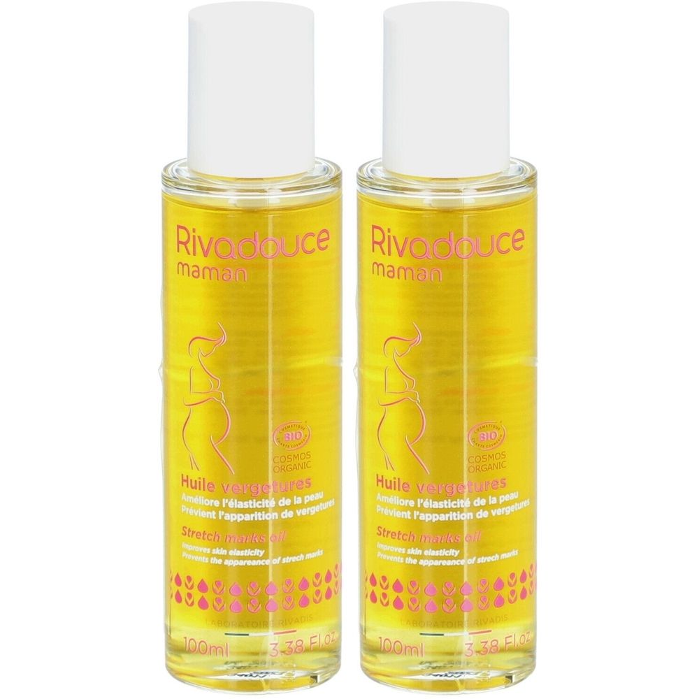Zwei Flaschen mit gelbem Öl. Aufschrift: Rivadouce maman, Huile vergetures. Weiße Kappen, rosa Etikett mit Umriss einer schwangeren Frau.