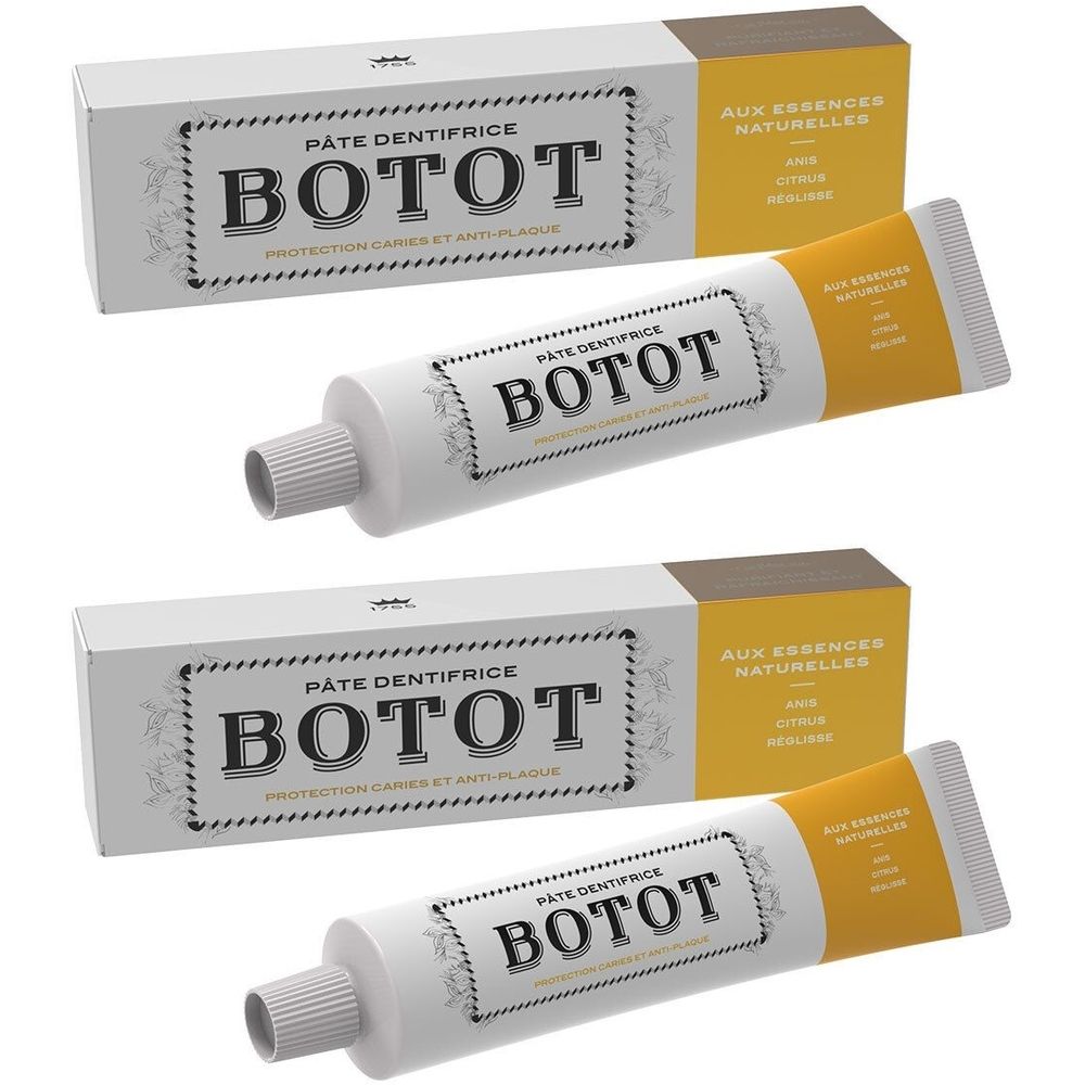 Tubes et boîtes de dentifrice. Inscription BOTOT. Tubes blancs avec bouchon gris et boîtes jaune-brun.