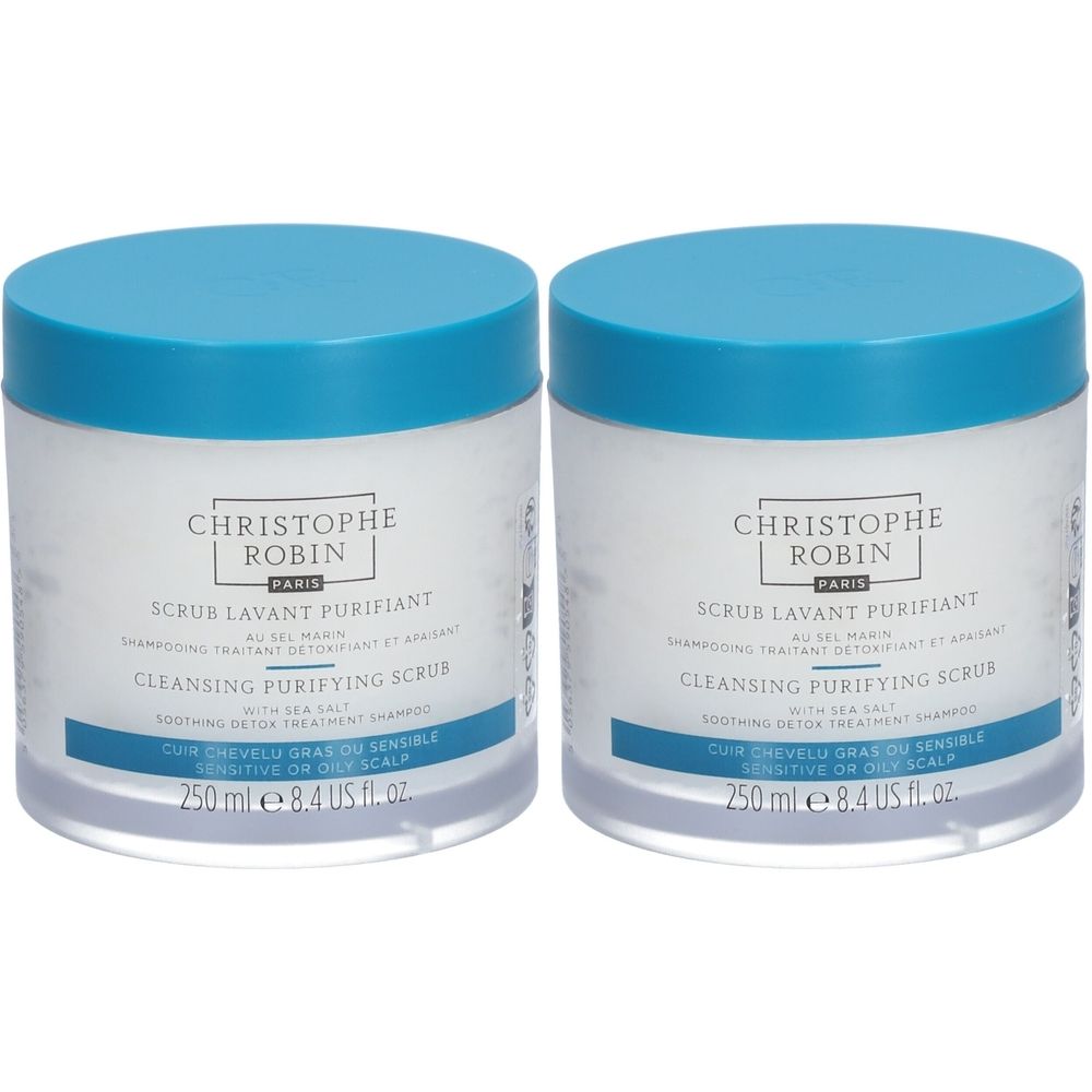 Deux pots cylindriques avec couvercles bleus. Inscription: CHRISTOPHE ROBIN PARIS, SCRUB LAVANT PURIFIANT, CLEANSING PURIFYING SCRUB. 250 ml.