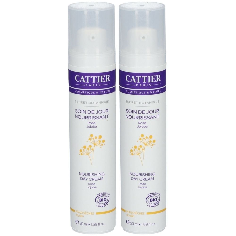Zwei weiße Flaschen mit lila Etiketten. Aufschrift: Cattier, Secret Botanique, Soin de Jour Nourrissant, Nourishing Day Cream. Bio-Siegel.