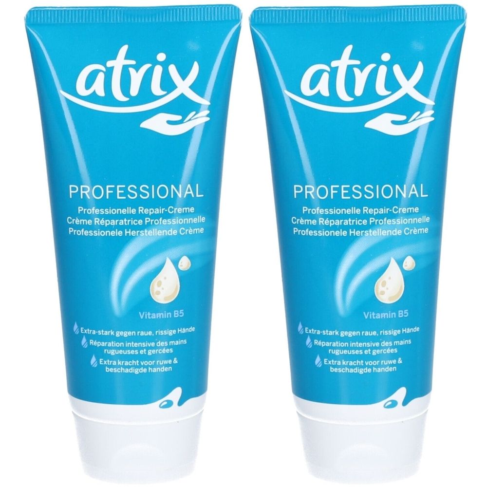 Deux tubes bleus de crème Atrix Réparatrice Professionnelle. Inscription: PROFESSIONAL, vitamine B5. Texte en allemand, français et néerlandais.