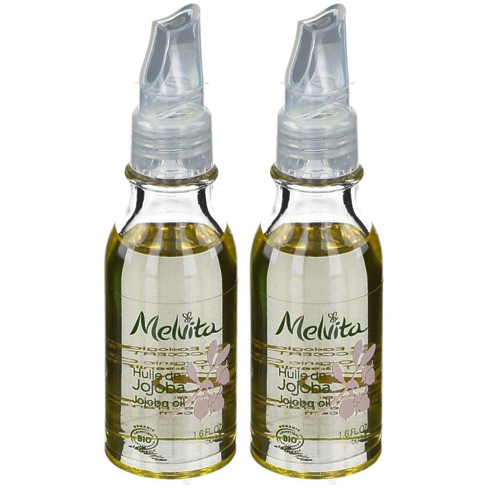 Zwei kleine Glasflaschen mit durchsichtigen Dosieraufsätzen. Aufschrift Melvita, Huile de Jojoba, Bio. Flüssigkeit gelblich.