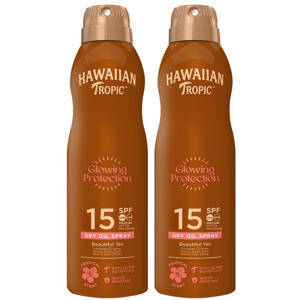 Deux flacons de brume solaire marron. Inscription: HAWAIIAN TROPIC, Glowing Protection, SPF 15, Dry Oil Spray.