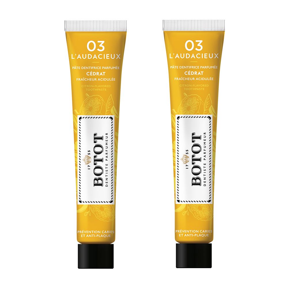 Deux tubes de dentifrice BOTOT. Inscription "Pasta Dentifricia, Protection caries et anti-plaque". Bande jaune avec texte "Aux essences naturelles".