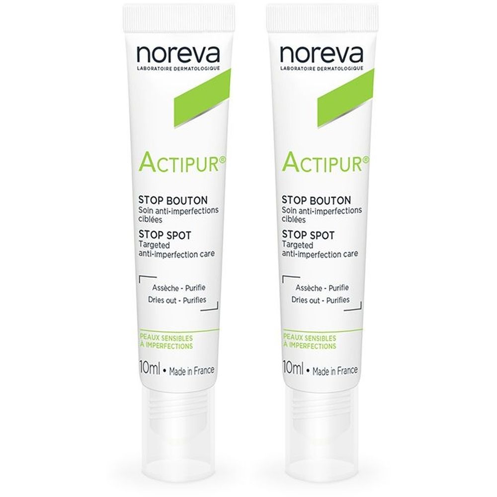 Deux tubes de Noreva Actipur Stop Bouton. Tubes blancs avec accents verts. Texte: Stop Bouton, Stop Spot, 10ml, Made in France.