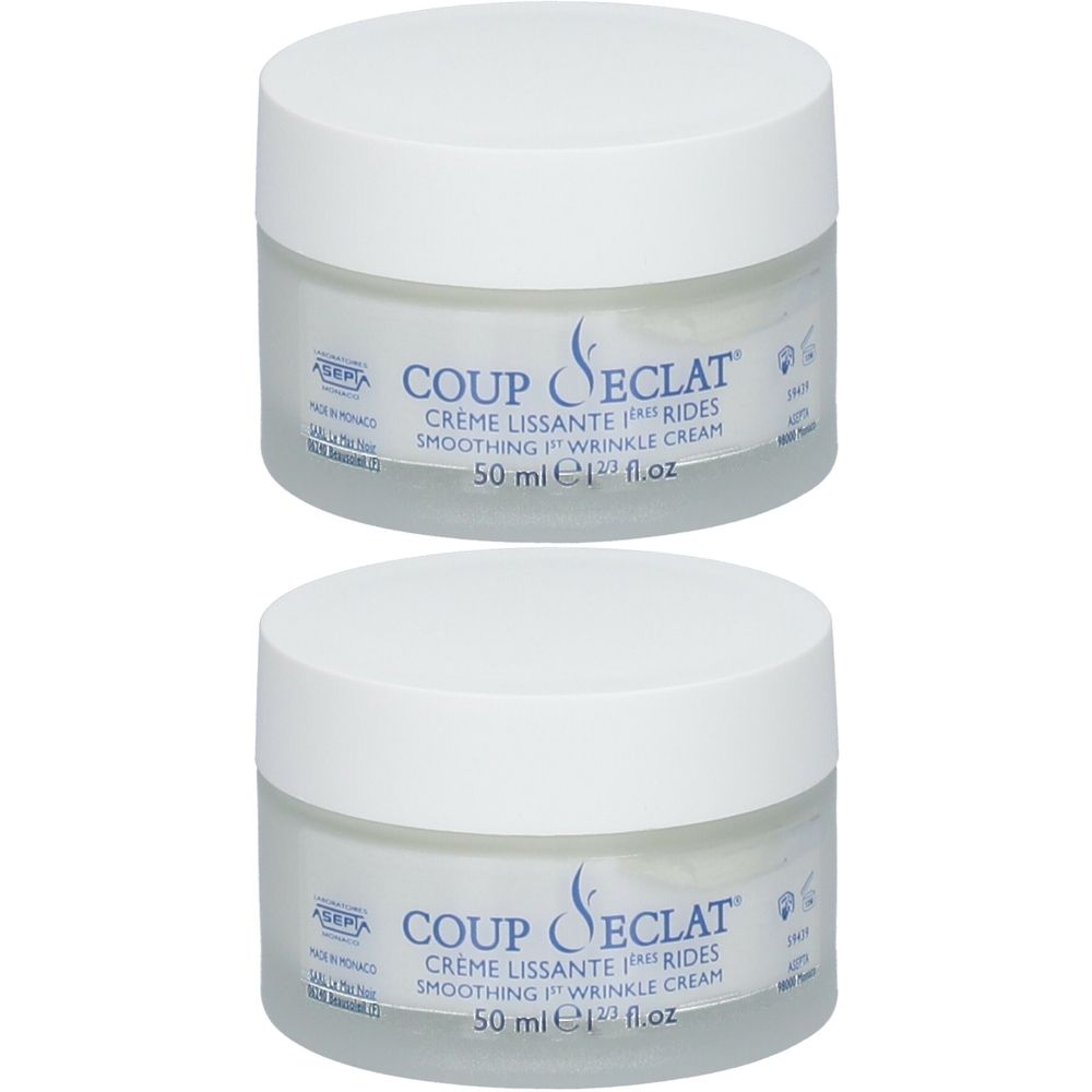 Zwei Tiegel Coup d'Éclat Creme Lissante 1ères Rides. Weiße Deckel, transparente Gläser. Aufschrift: Creme Lissante 1ères Rides, 50 ml.