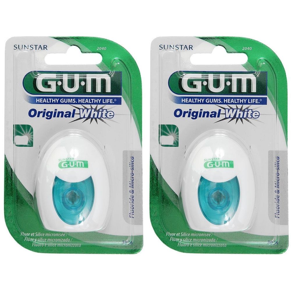 Deux paquets de fil dentaire GUM Original White. Récipients blancs ovales avec cœur bleu, emballage vert. Inscriptions : GUM, Original White.