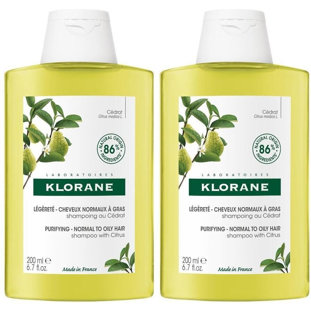 Deux flacons jaunes de KLORANE Shampoing au Cédrat. Inscription : LÉGÈRETÉ-CHEVEUX NORMAUX À GRAS, PURIFYING - NORMAL TO OILY HAIR. 86% d'ingrédients naturels.