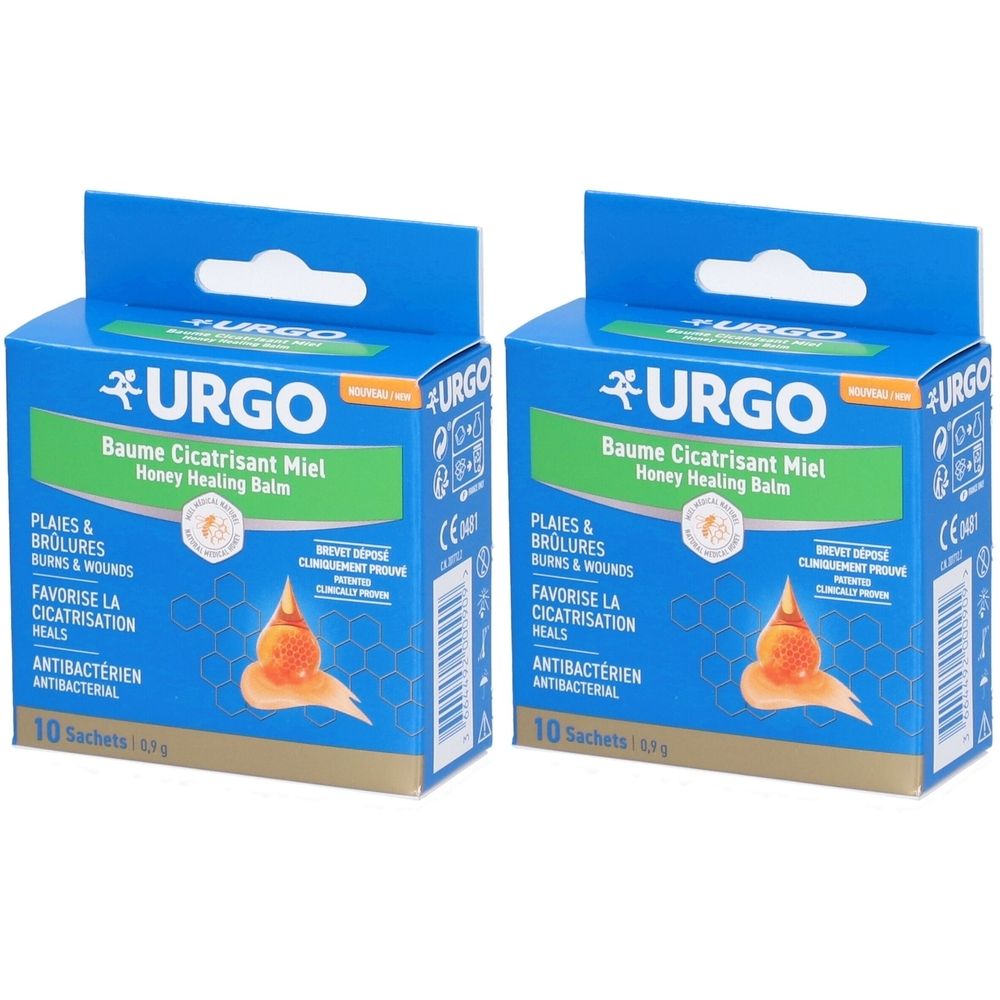 Zwei blaue Kartons mit Produktaufdruck. Aufschrift: URGO, Baume Cicatrisant Miel, Honey Healing Balm. Enthält 10 Sachets. CE-Kennzeichnung.