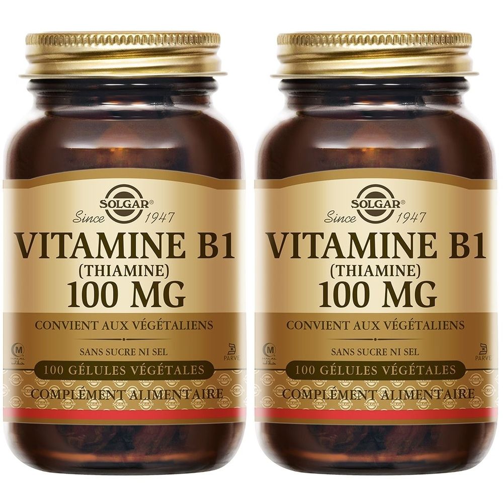 Zwei braune Glasflaschen mit goldfarbenen Deckeln. Auf jeder Flasche steht "VITAMINE B1 100 MG" und "SOLGAR".