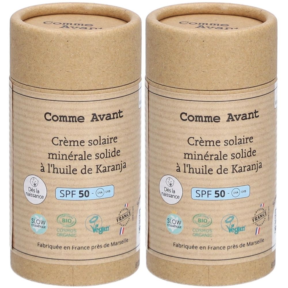 Deux tubes cylindriques de crème solaire. Inscription : Comme Avant, Crème solaire minérale solide à l'huile de Karanja, SPF 50. Certifié bio.