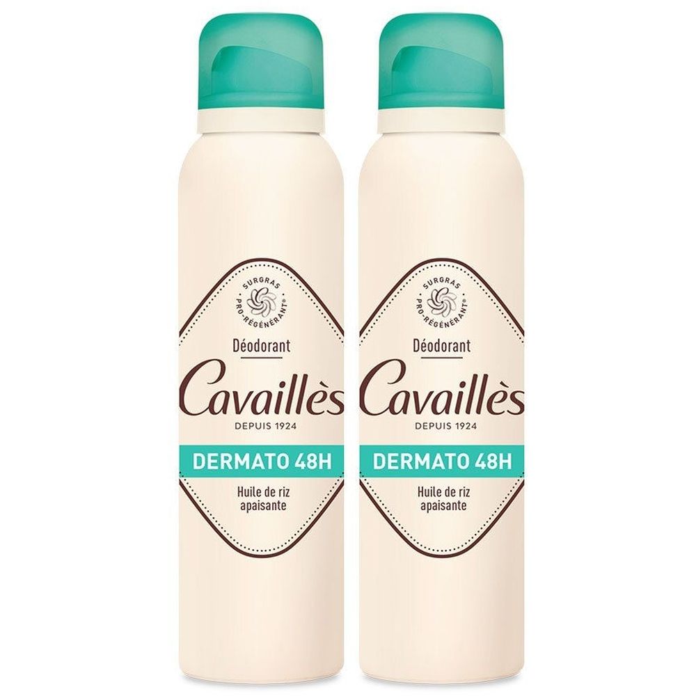Zwei Sprühflaschen mit türkisfarbenen Kappen. Aufschrift: Cavaillès Déodorant Dermato 48H. Mit Reisöl.