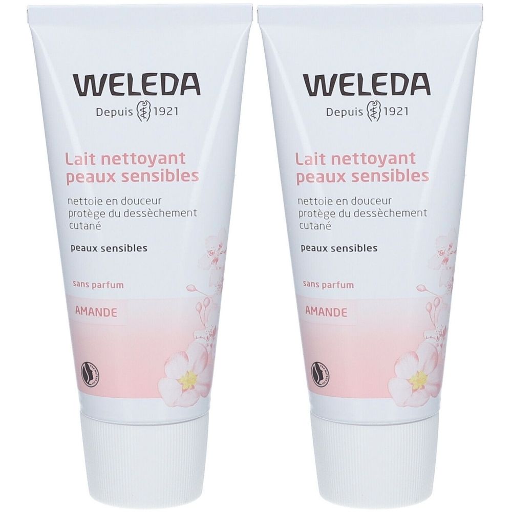 Deux tubes de Lait Nettoyant WELEDA. Blancs, avec texte et motif floral. Nom du produit et marque visibles.