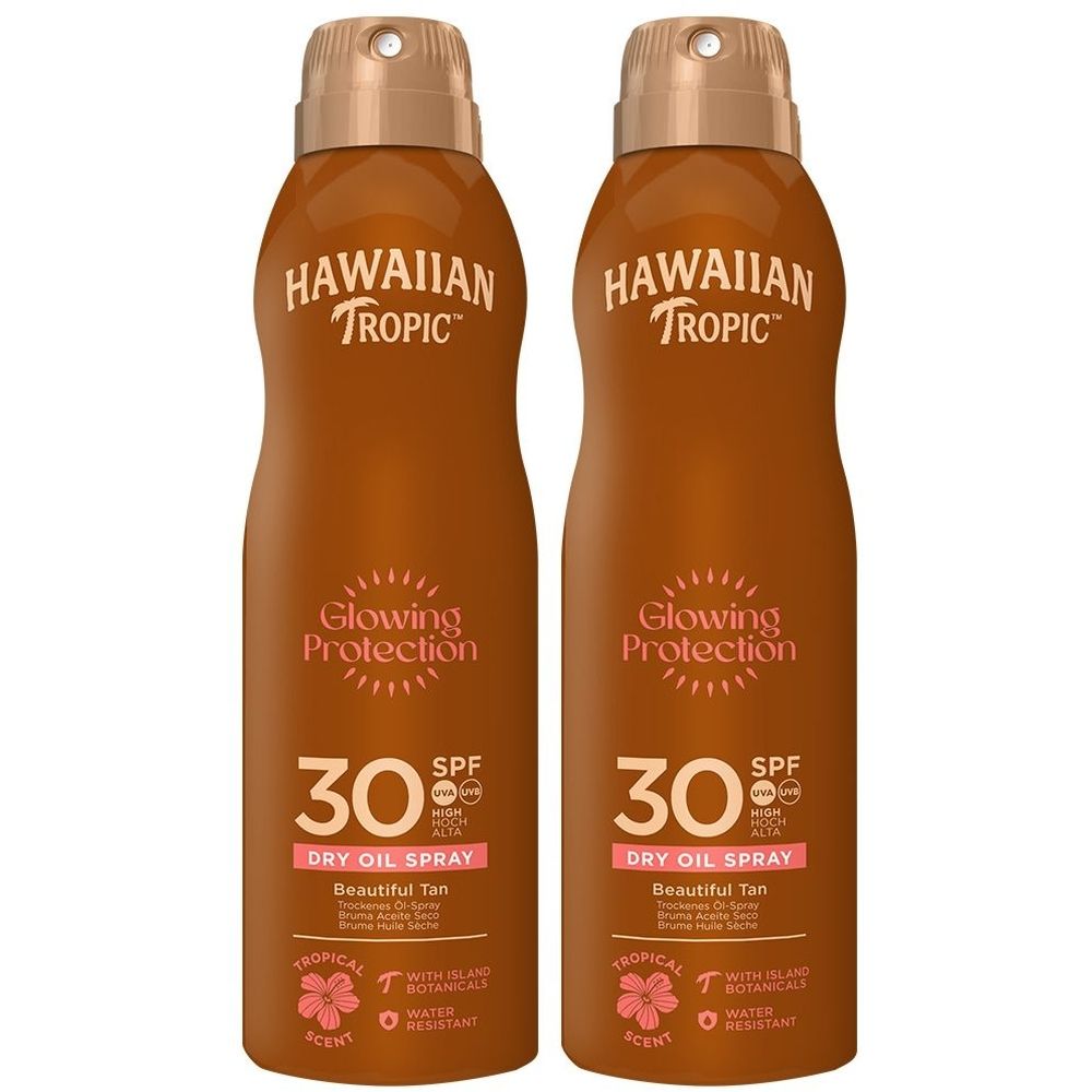 Zwei braune Sprühflaschen. Aufschrift: HAWAIIAN TROPIC, Glowing Protection, SPF 30. Trockenes Ölspray.