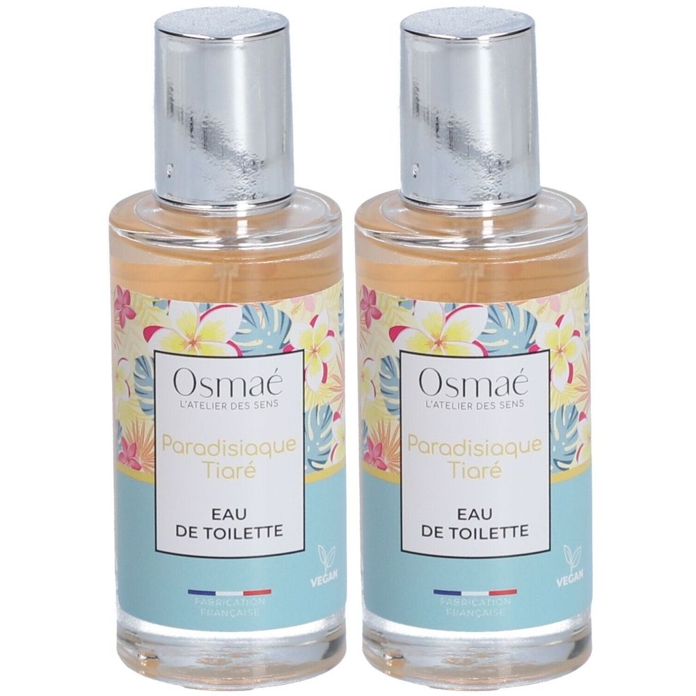 Zwei Flakons Osmaé Eau de Toilette Paradisiaque Tiaré. Transparente Flakons mit silbernen Kappen und floralem Etikett.