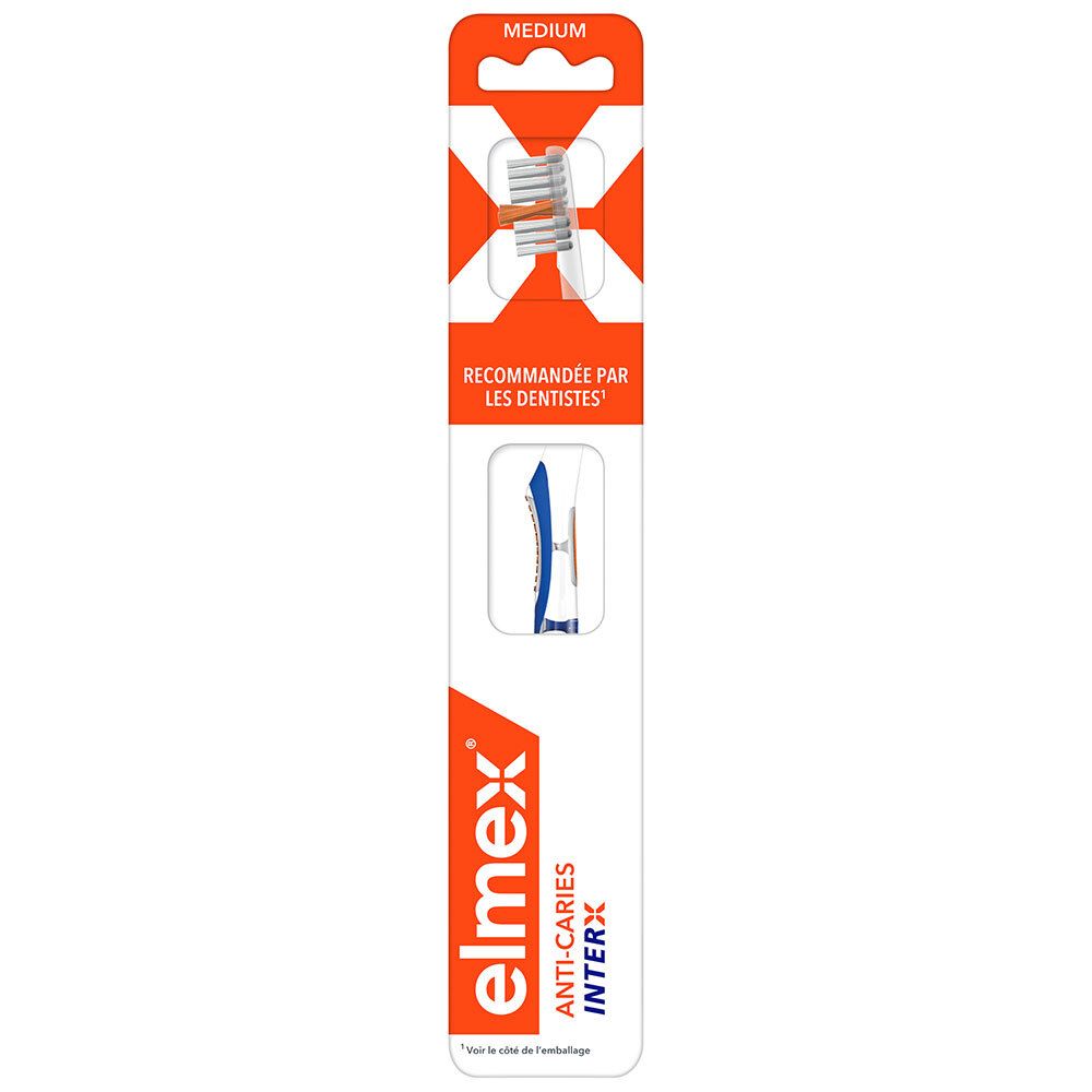 Brosse à dents dans son emballage. Design orange et blanc. Logo "Elmex". Inscription "Anti-Caries InterX". Indication "Medium".