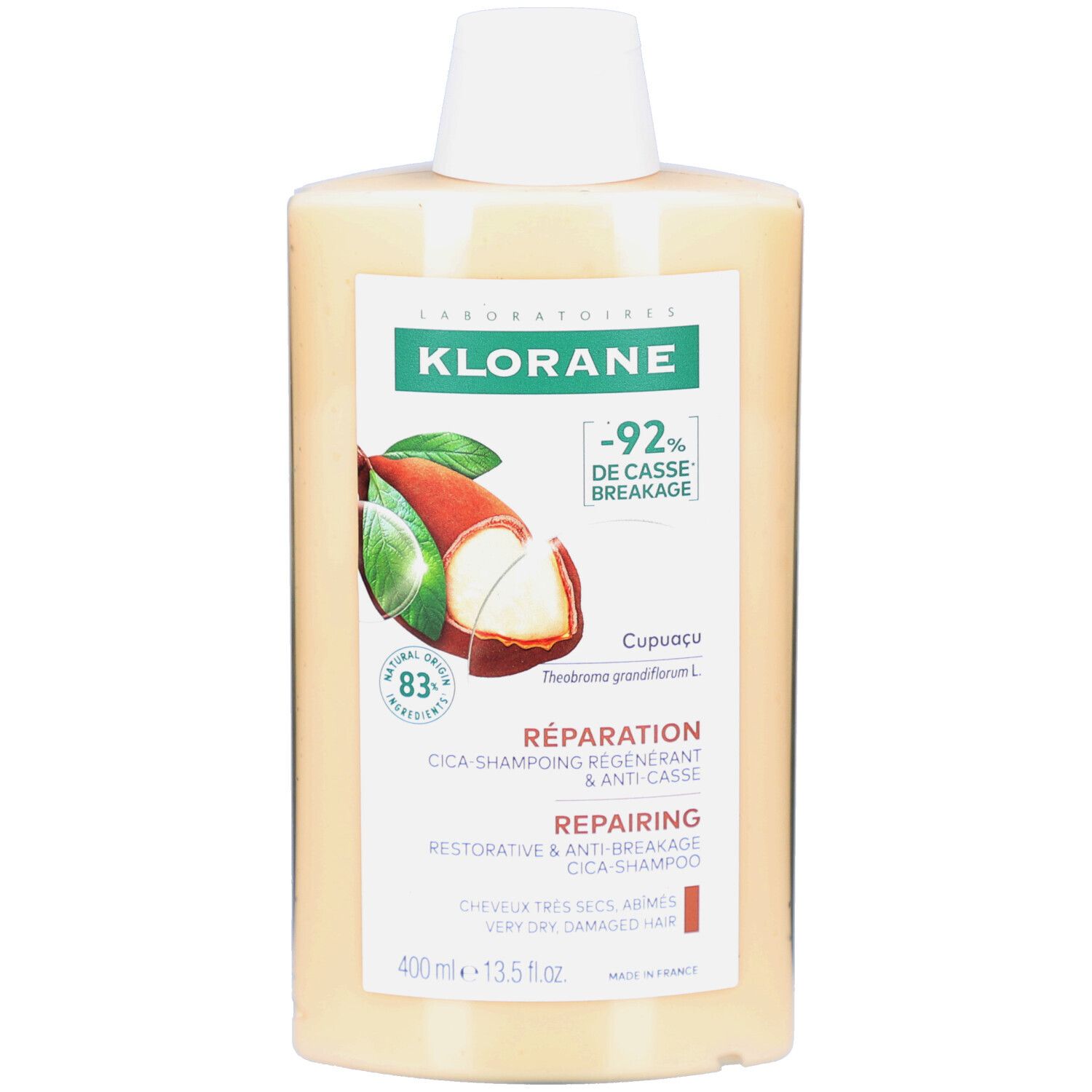 Flacon de KLORANE Cica-Shampoing. Étiquette avec informations produit et illustration de fruit de Cupuaçu. 400 ml.