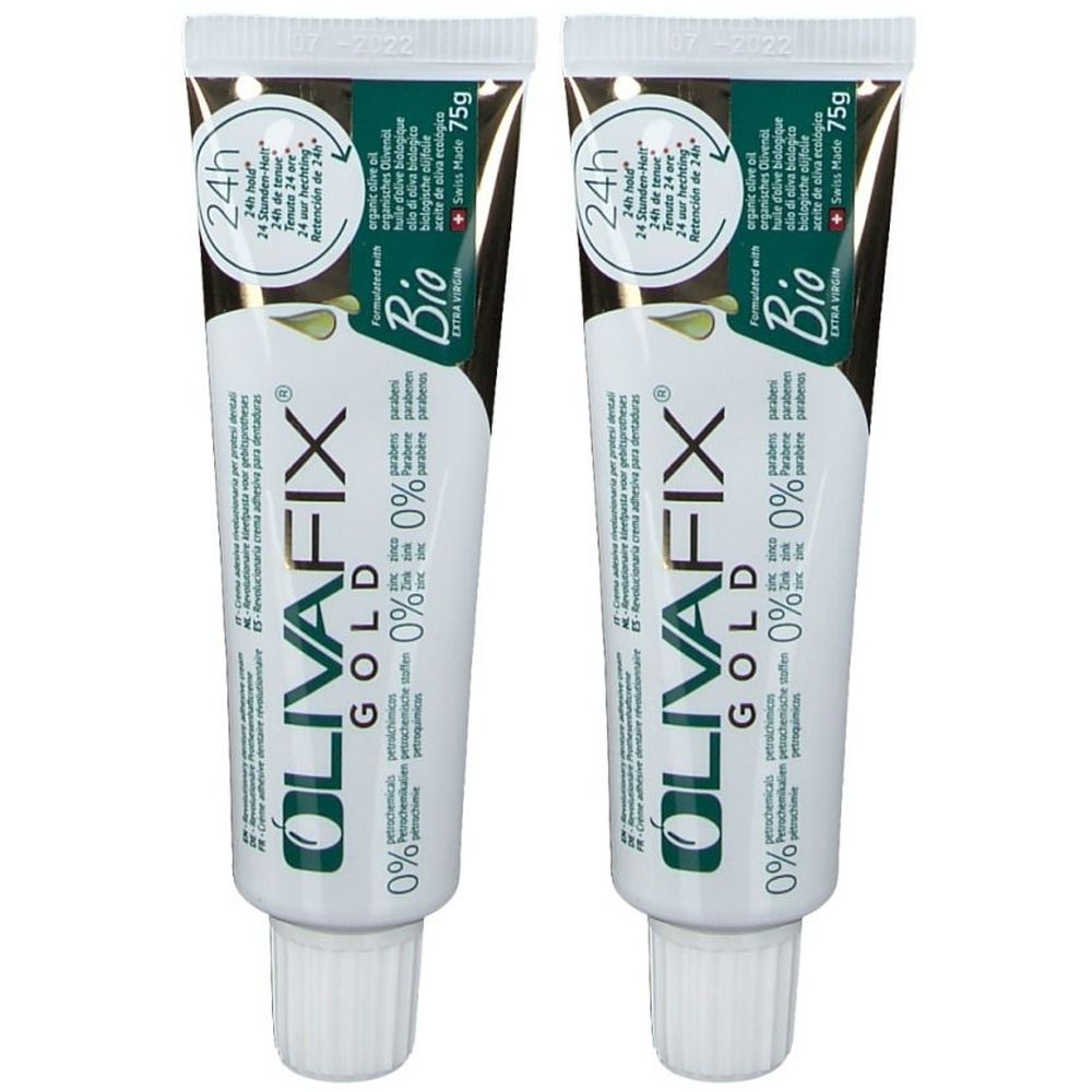 Deux tubes de crème adhésive dentaire OlivaFix GOLD. Tubes blancs avec texte vert et doré. Label Bio et indication 24h.