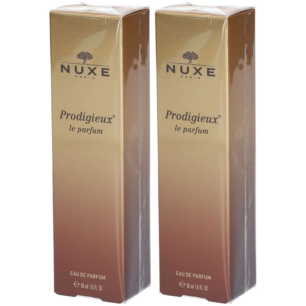Zwei rechteckige Schachteln. Aufschrift: Nuxe Paris, Prodigieux le parfum. Farbverlauf von Gold zu Braun. Eau de Parfum.