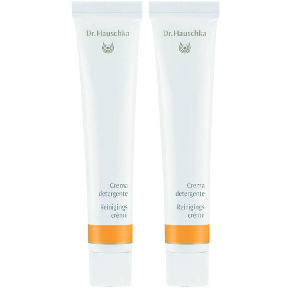 Zwei Tuben Crème Purifiante. Weiß, mit orangefarbenem Streifen und Schriftzug Dr. Hauschka. Aufschrift: Crema detergente, Reinigings crème.
