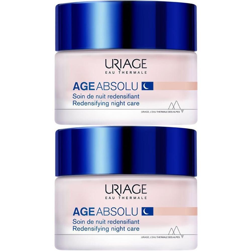Deux pots de soin de nuit Uriage Age Absolu. Pots beiges avec couvercles bleus. Inscription: Uriage, Age Absolu, Soin de nuit.