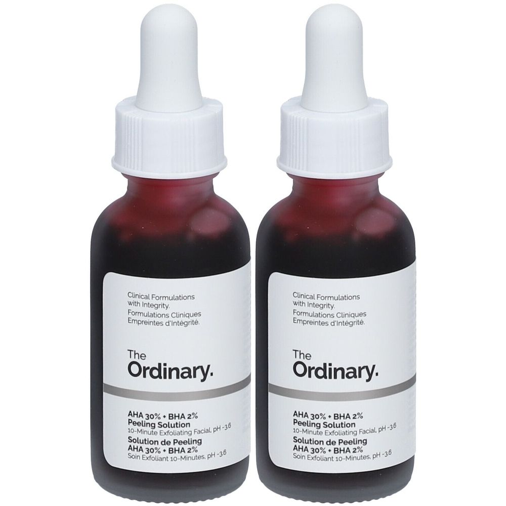 Deux flacons de solution rouge. Inscription: The Ordinary. Solution de peeling AHA 30% + BHA 2%. Avec pipette.