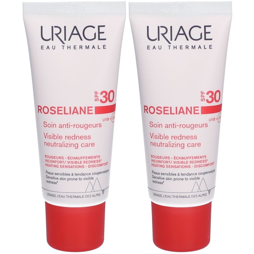 Deux tubes de crème Uriage Roséliane Anti-rougeurs SPF30. Tubes blancs avec bouchons rouges. Texte : Roséliane, SPF30, Soin anti-rougeurs.