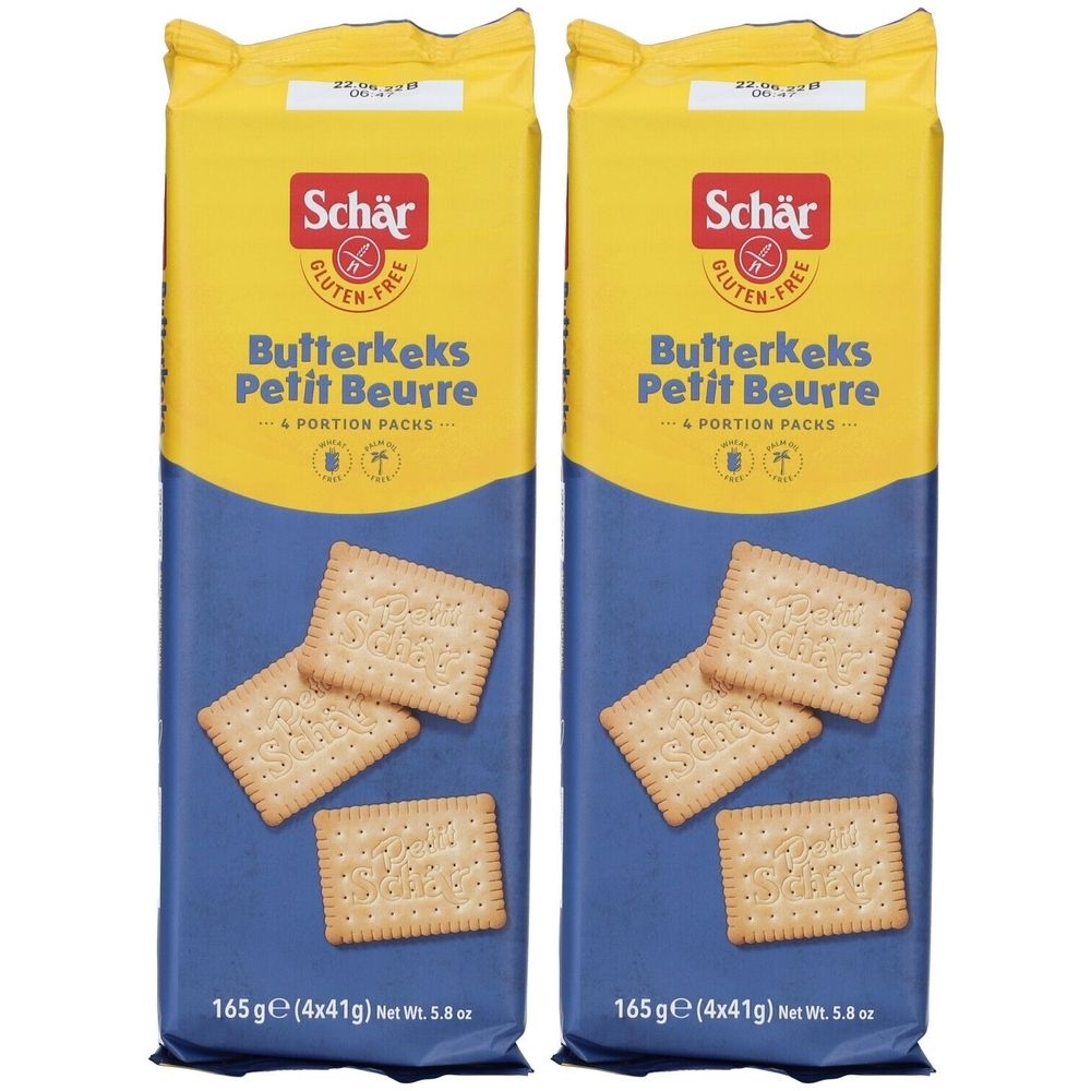 Deux paquets de biscuits au beurre Schär. Emballage jaune et bleu. Inscription : Butterkeks Petit Beurre, sans gluten.