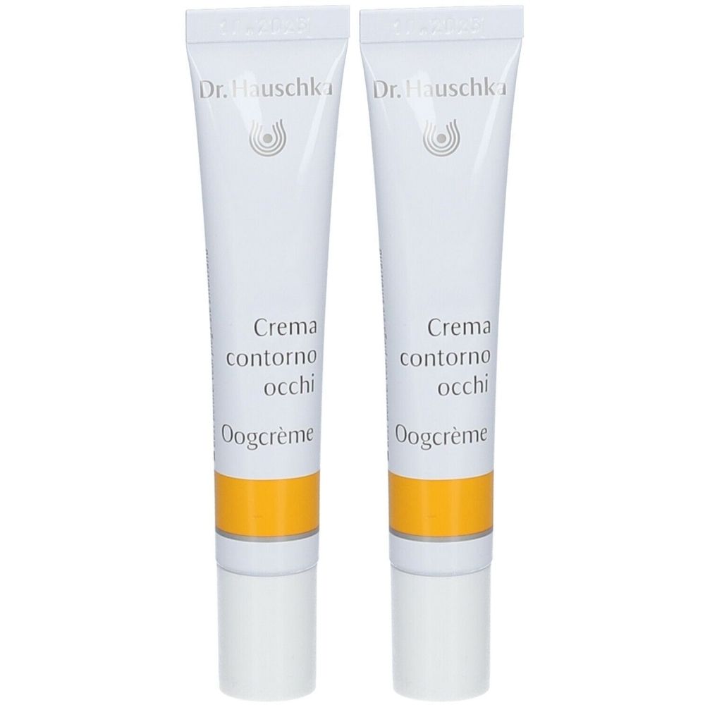 Zwei Tuben Augencreme. Weiß, mit gelbem Streifen und Schriftzug. Marke: Dr. Hauschka. Text: Crema contorno occhi, Oogcrème.
