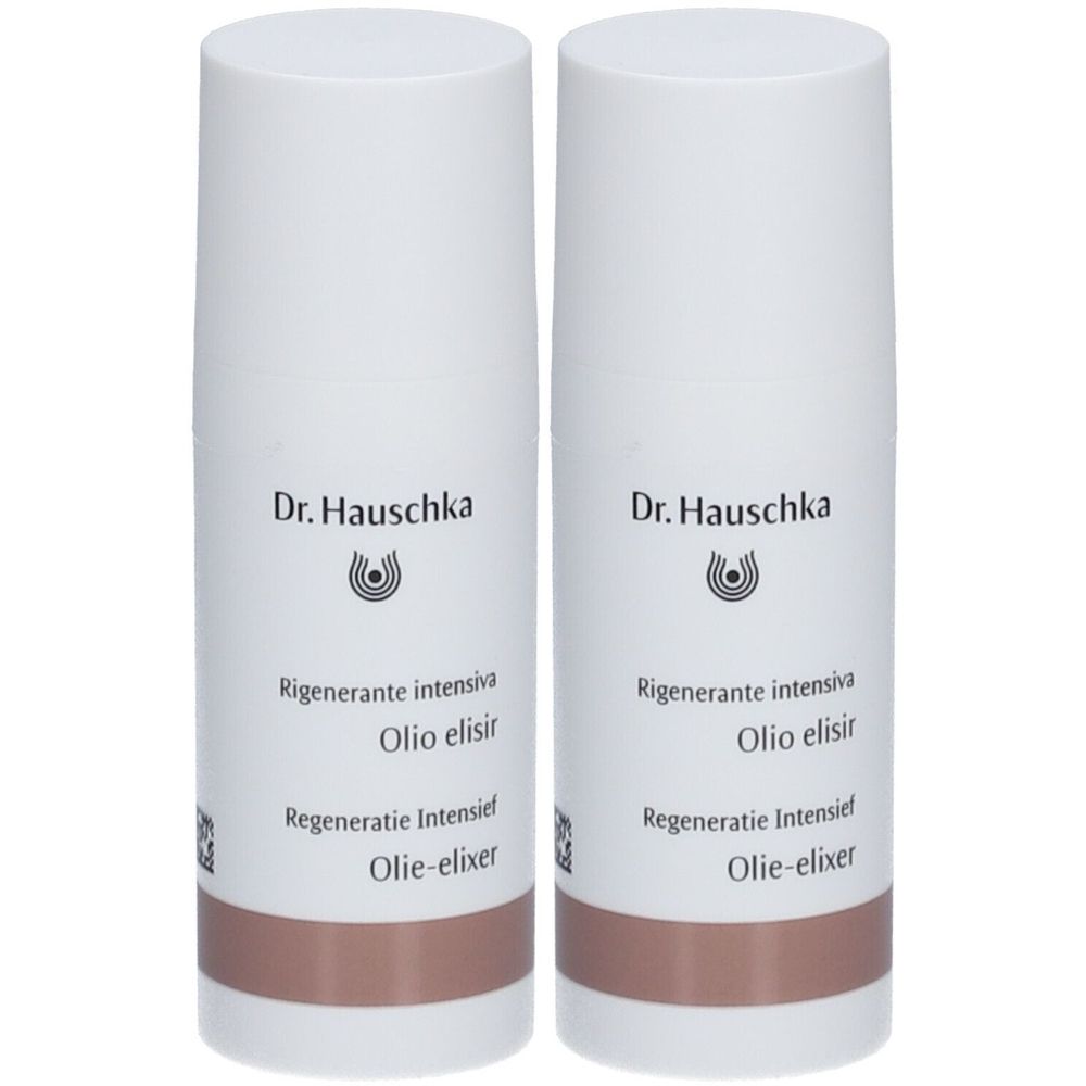 Zwei weiße Flaschen mit braunem Unterteil. Aufschrift: Dr. Hauschka, Rigenerante intensiva, Olio elisir, Regeneratie Intensief, Olie-elixer.