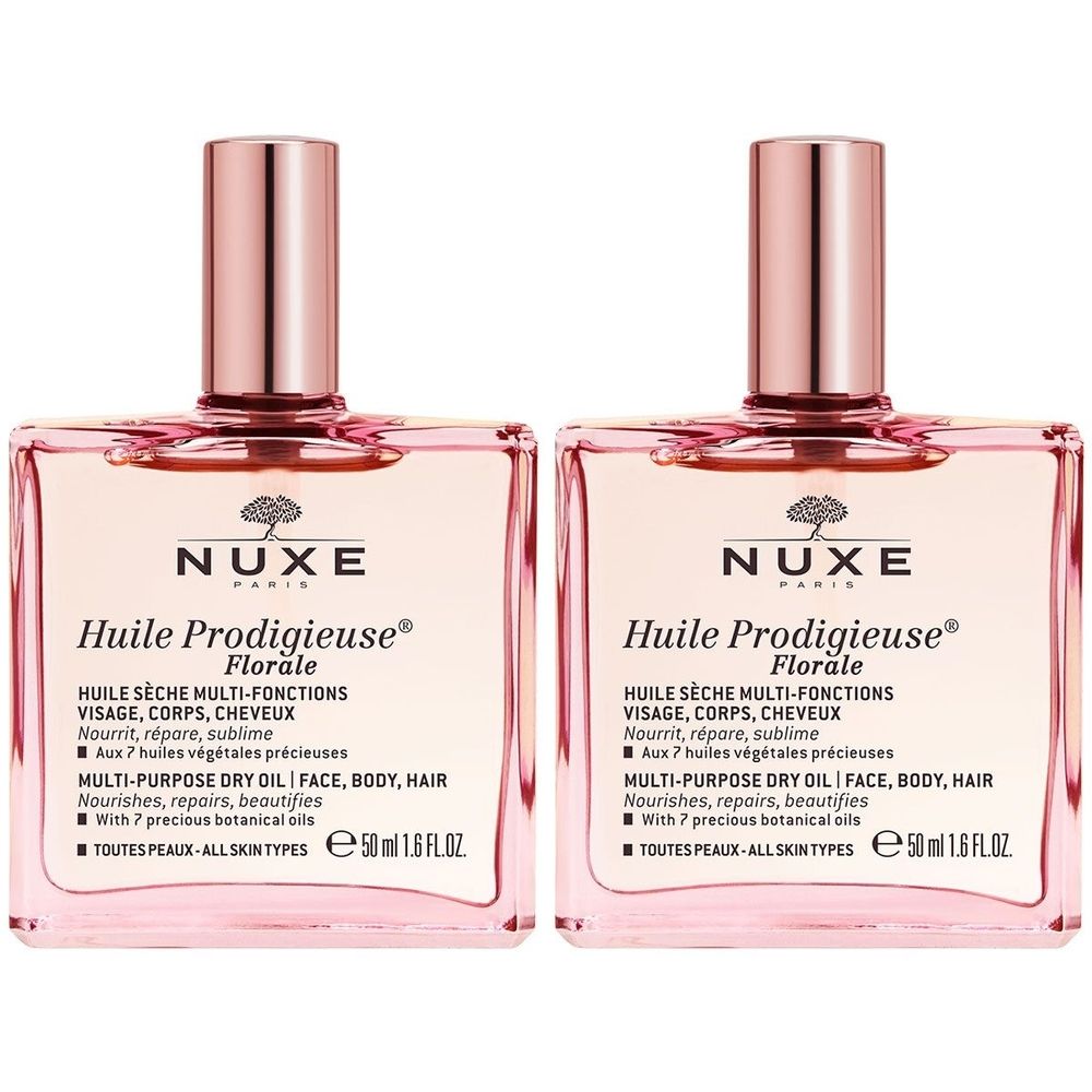 Deux flacons carrés avec liquide rose et bouchons roses. Inscription: NUXE Huile Prodigieuse Florale. 50 ml.