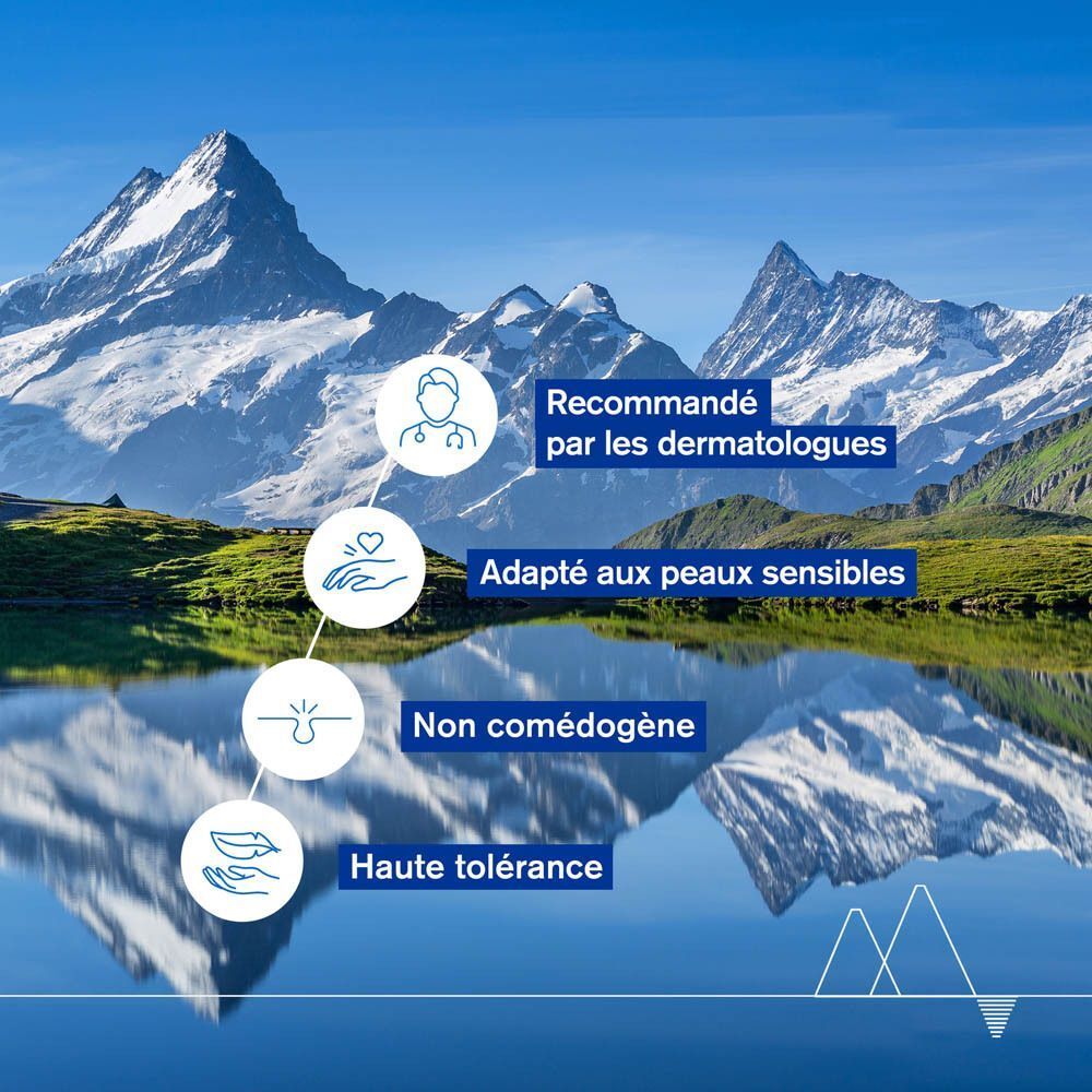 Paysage avec montagnes et lac. Texte: Recommandé par les dermatologues, peaux sensibles, non comédogène, haute tolérance.