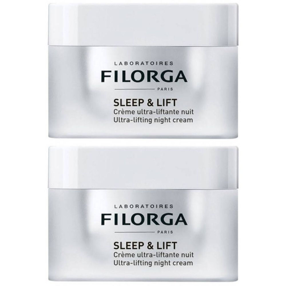 Deux pots de crème de nuit FILORGA Sleep & Lift. Verre blanc avec couvercle blanc. Texte noir : FILORGA, SLEEP & LIFT, Crème ultra-liftante nuit.