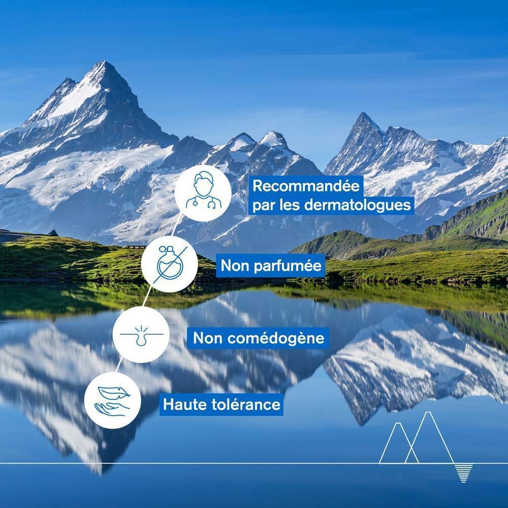 Paysage avec montagnes et lac. Texte: Recommandée par les dermatologues, Non parfumée, Non comédogène, Haute tolérance.