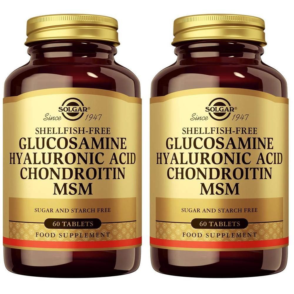 Deux flacons en verre brun avec bouchons dorés, contenant chacun 60 comprimés de Solgar Glucosamine Acide Hyaluronique Chondroïtine MSM.