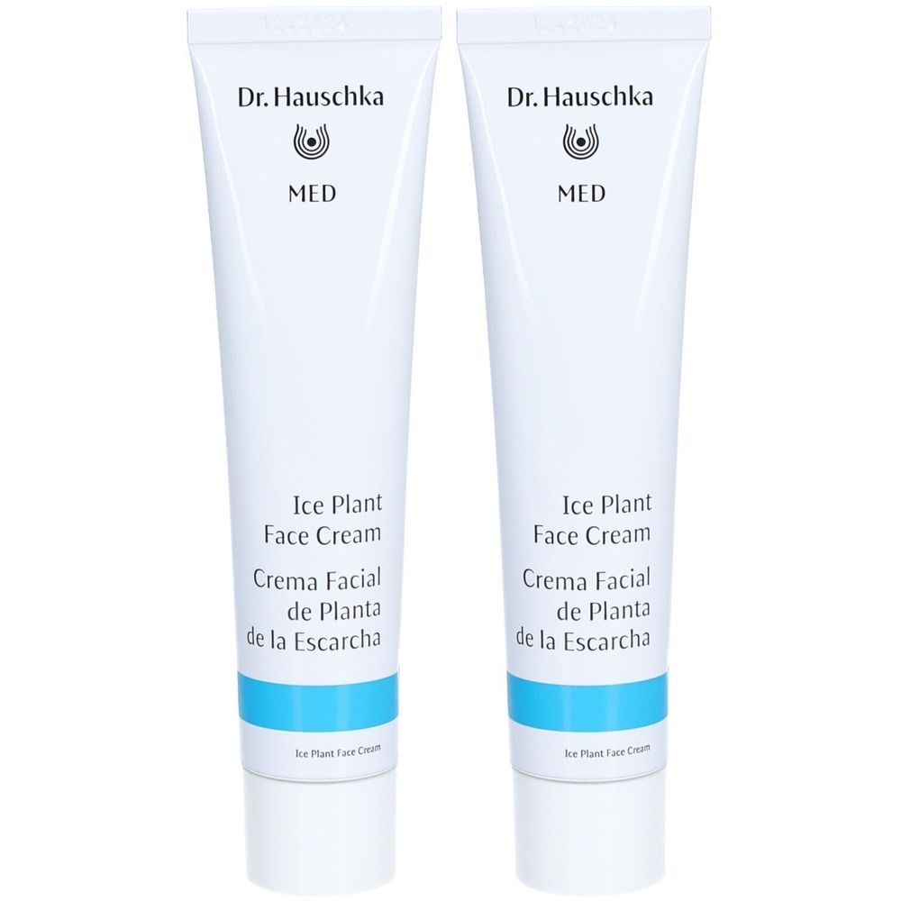 Zwei weiße Tuben mit Produktbeschriftung. Aufschrift: Dr. Hauschka, MED, Ice Plant Face Cream, Crema Facial de Planta de la Escarcha.