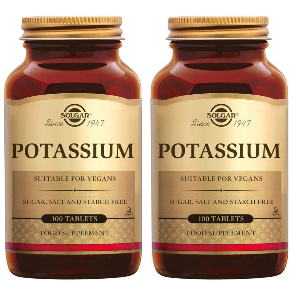 Deux flacons en verre brun avec des bouchons dorés. L'étiquette indique "Potassium" et "Solgar". Convient aux végétaliens, sans sucre, sel ni amidon.