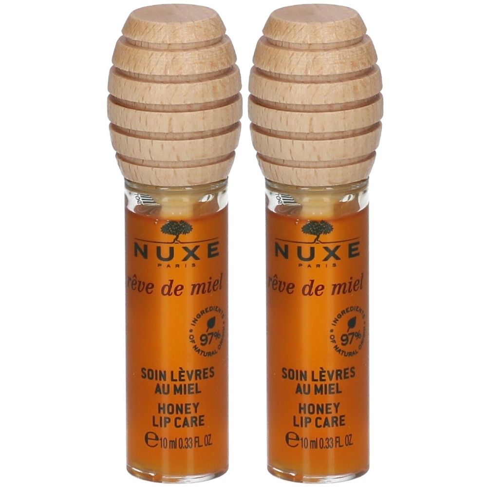 Zwei Lippenpflege-Tuben mit Holzaufsatz. Aufschrift: NUXE, Rêve de Miel, Soin Lèvres au Miel, Honey Lip Care. 97% natürliche Inhaltsstoffe.