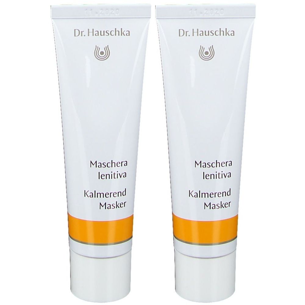 Deux tubes de Masque Apaisant Dr. Hauschka. Tubes blancs avec bande jaune et texte. Noms de produits en allemand, italien et anglais.
