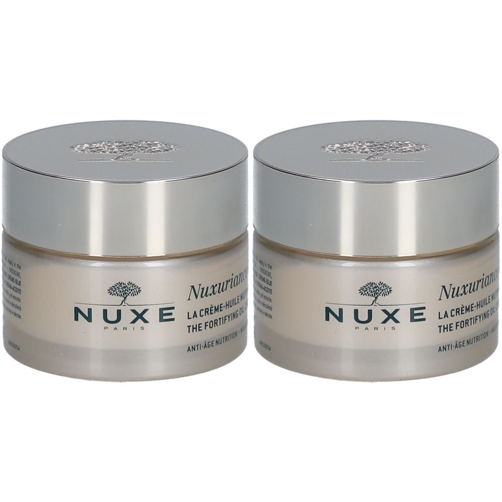 Zwei Tiegel Nuxe Nuxuriance® Gold Crème-huile nutri-fortifiante. Glasbehälter mit silbernem Deckel. Aufschrift Nuxe Paris.