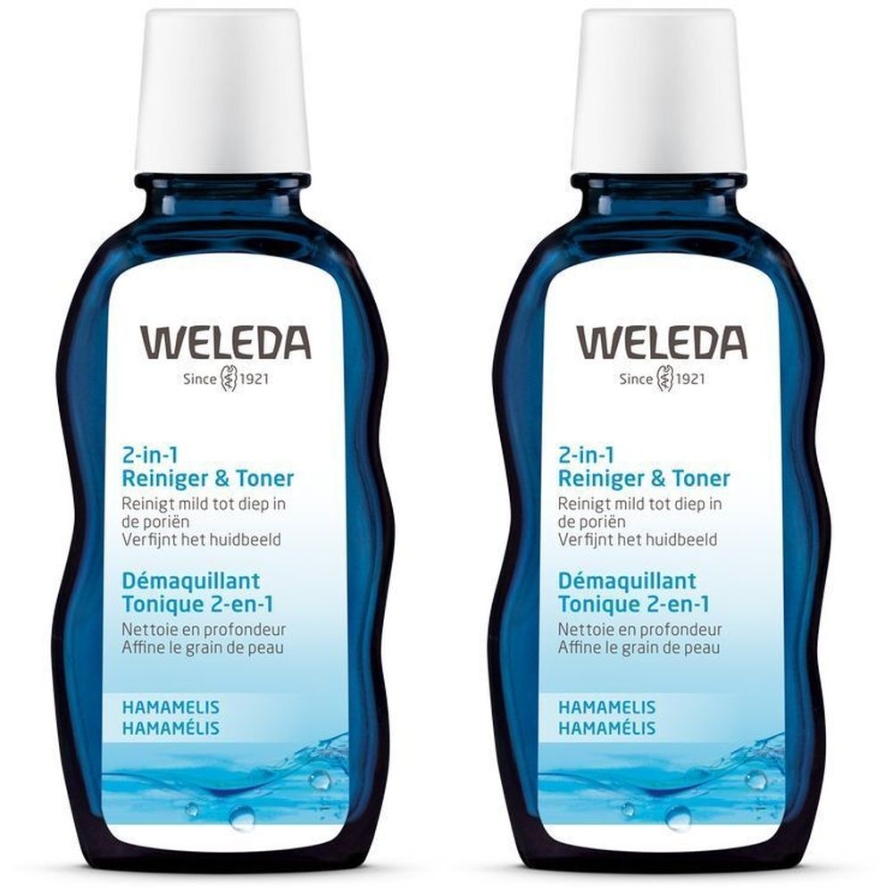 Deux flacons bleus avec bouchons blancs. Inscription: WELEDA, 2-en-1 Nettoyant & Tonique, Hamamélis. Design en forme de vagues.